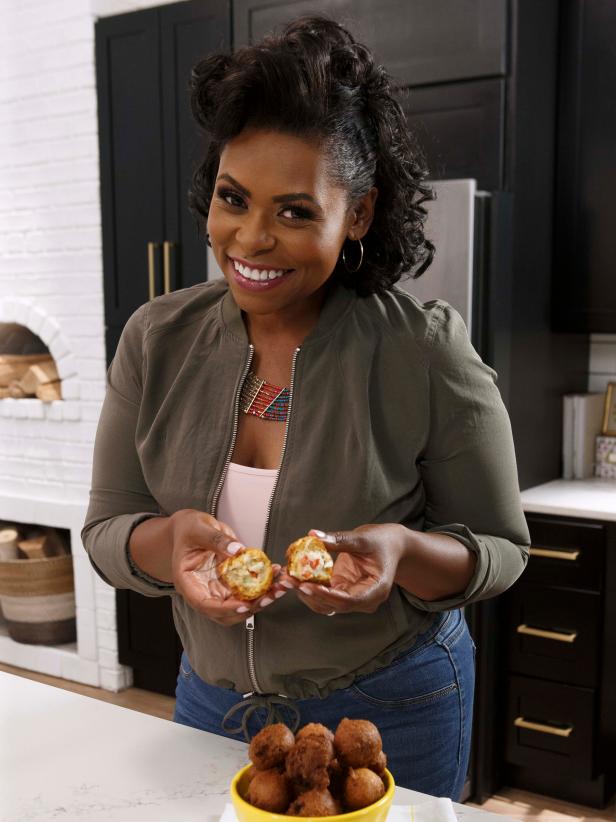 Host Jamika Pessoa poses with her Crab Stuffed Hush Puppies, or Crush Puppies, as seen on Let's Eat, Season 1.