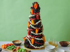 This festive kale tree decked with cheese-stuffed mini chile pepper lights is the perfect centerpiece for your next holiday party. Your guests can help themselves to the chile peppers with a quick tug of a bow.