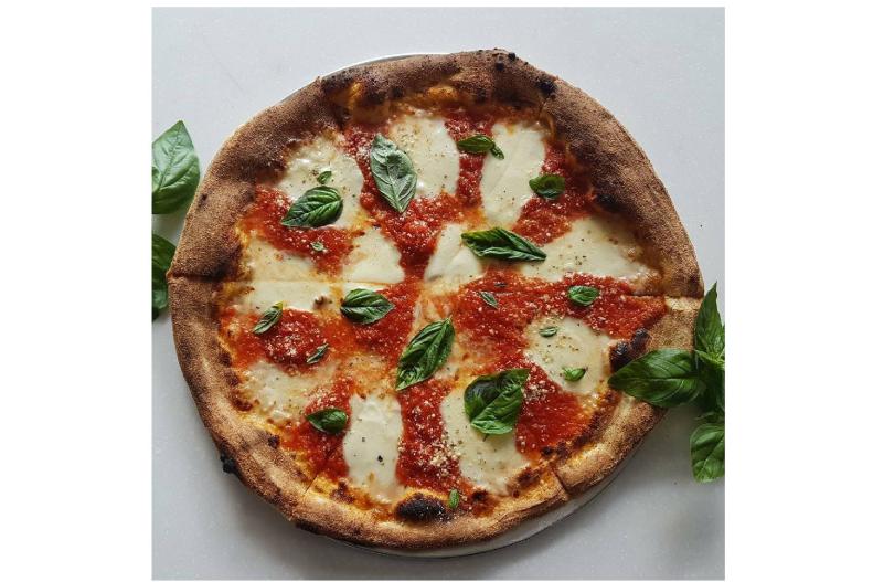 Hoping to fill a void of true big-city pizza, father and son Russell and Parker Lee found the sweet spot with Green Fire Pizza. Using an 800-degree wood-fired pizza oven imported from Italy, they are cooking up perfectly charred Old World Neapolitan-style pizza with a thin and crunchy â   yet still slightly doughy â   crust filled with local and organic ingredients. Available by the slice or the pie, the classic margherita sets the bar with San Marzano tomato sauce, fresh mozzarella, garlic and locally grown Genovese basil. But don't overlook the Lemon Chicken Cheddar pizza or the famous Giardino, with Calabrian chile pesto, broccolini, cherry tomatoes and sausage. Or create your own with more than two dozen out-of-the-(pizza)-box toppings.