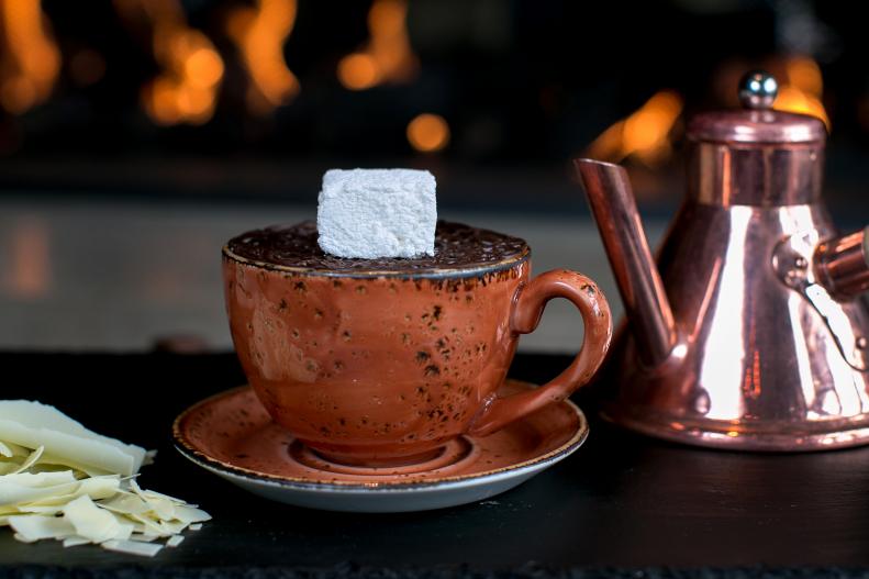After a long day of skiing there is nothing more indulgent than cozying up to the bar with this luxe hot chocolate made with heavy cream and whole milk mixed with Valrhona dark & milk chocolate. The presentation is equally decadent: A homemade marshmallow is placed on a chocolate lattice that slowly melts when the hot chocolate is poured to release the marshmallow before you drink it.