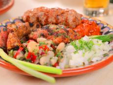 <p>While still in college, Chef Nina Manchev opened her Bulgarian restaurant at the age of 23. The mixed grill plate with three different types of Bulgarian sausage captured Guy's heart. Topped with dry cured Bulgarian charcuterie, the Thracian Clay Pot was another one of Guy's favorites.</p>
