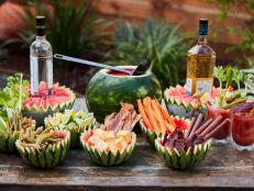 Celebrate summer with this show-stopping Bloody Mary bar. Watermelons of all sizes are turned into garnish bowls in addition to flavoring the traditional cocktail with a watermelon twist.