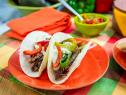 Jeff Mauro makes Grilled Prime Cheesesteak Tacos with his father Gus Mauro, as seen on Food Network's The Kitchen