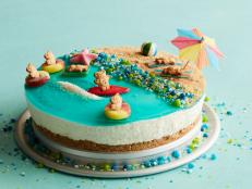 Make a splash at your next cookout with this adorable beach-scene cheesecake. The no-bake filling is prepped the day before, leaving you plenty of time for the fun part: decorating the graham cracker beach with sea glass candy and floating teddy bears.