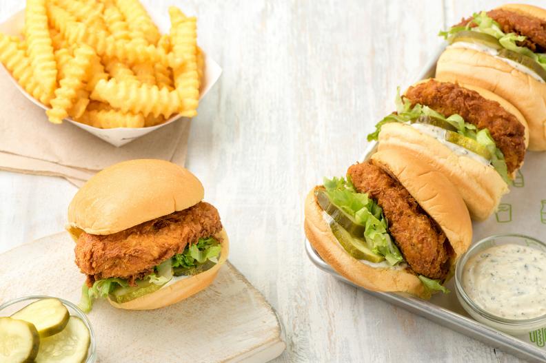 Years after developing a global cultlike following for its modern yet casual burgers, in 2016 Shake Shack decided to get into the fried chicken sandwich game. As one would expect, the Chick’n Shack is also done extremely well. Starting with a cage-free bird treated with no hormones or antibiotics ever, the chicken breast is slow-cooked in a creamy buttermilk marinade before being hand-dipped in a special batter, dredged through seasoned flour and tossed into the fryer. The crisp, crackly and flavorful breast is so plump it bulges out the sides of its spongy potato bun, which is stuffed to the gills with pickles, shredded lettuce and a wonderful Shack-made buttermilk herb mayo with chives, parsley and thyme.