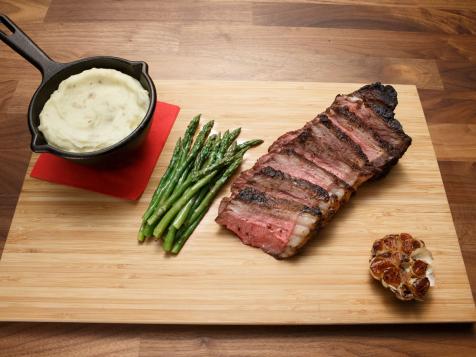 New York Strip with Maitre Butter, Horseradish Mashed Potatoes and Asparagus