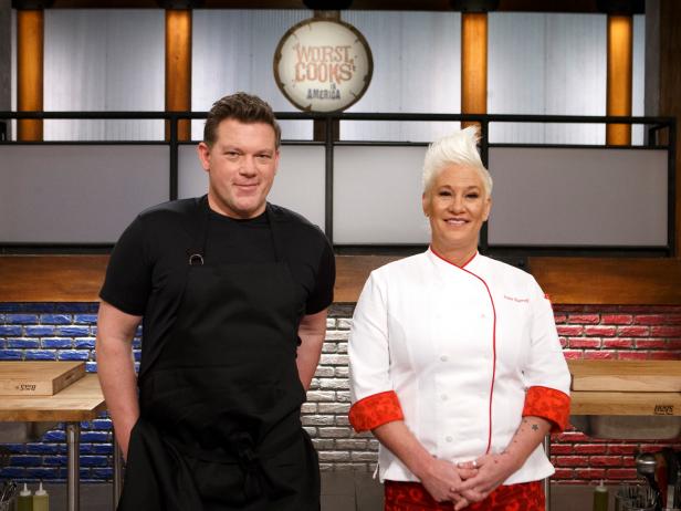 Mentors Tyler Florence and Anne Burrell pose together, as seen on Worst Cooks in America, Season 19.