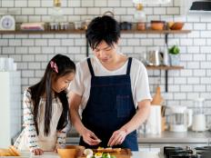 Young father and daughter cooking together at home. Tokyo Japan