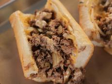 <p>There&rsquo;s always something new and delicious to try at this sandwich joint, and the Woodrow&rsquo;s Whiz Wit is just one example. Chef and owner Kevin Kramer adds his own twist on the classic Philly cheesesteak with his homemade cherry pepper mayo. &ldquo;The cherry pepper mayo has a little bit of acidity,&rdquo; Guy said, &ldquo;which is really key and essential.&rdquo; Cheesesteak veterans and newbies alike will also fall for the homemade whiz, which is a creamy cheese sauce that&rsquo;s traditionally served on top of the shaved beef. Kevin&rsquo;s take on whiz features four different types of cheese and sliced truffle, and its flavors impressed Guy. &ldquo;It takes cheesesteak to another level!&rdquo;</p>