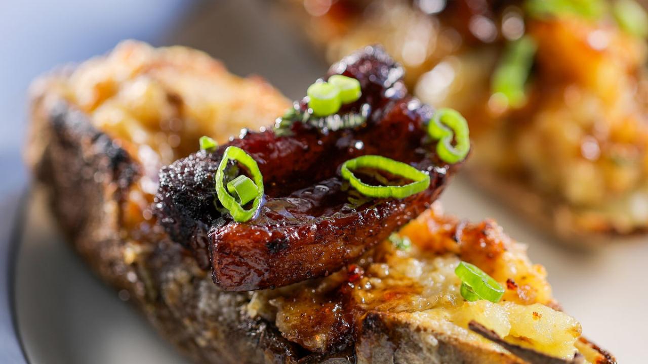 Twice-Baked Potatoes with Crispy Pork Belly and Cheddar Cheese