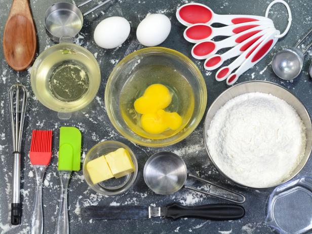 Baking ingredients and utensils for preparing cakes and pastries.