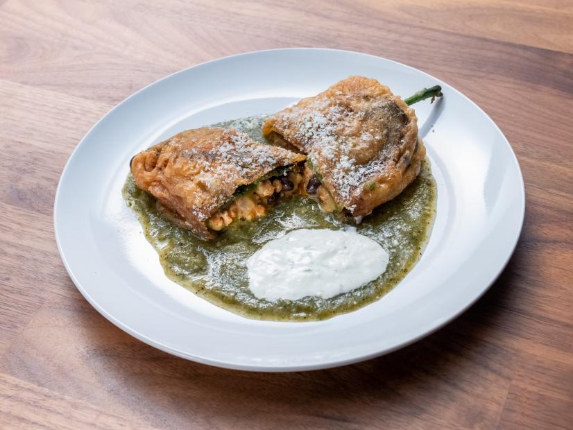 The Main Dish from the Red Team Demo, featuring chile relleno with chorizo and black beans with verde sauce, as seen on Worst Cooks In America, Season 24.