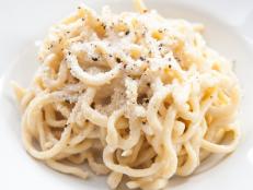 Tonnarelli cacio e pepe is a typical Lazio specialty, Italy, spaghetti with pecorino cheese and pepper  on white background