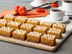 Double the holiday fun with these spiced pumpkin gingerbread bars! Soft and cakey with a slight chew, these bars feature two distinct layers: pumpkin and gingerbread, which get drizzled with an irresistible cream cheese icing.