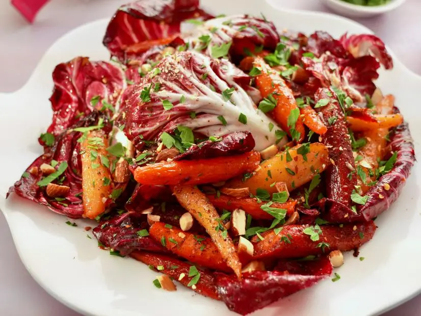 Beauty shot of Molly Yeh's Honey-Glazed Carrots with Radicchio and Thyme as seen on Girl Meets Farm, Season 11.