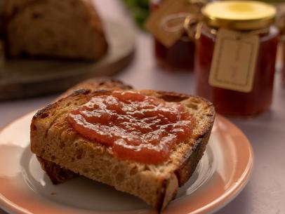 Beauty shot of Molly Yeh's Rhubarb Rose Jam spread out on bread as seen on Girl Meets Farm, Season 11.