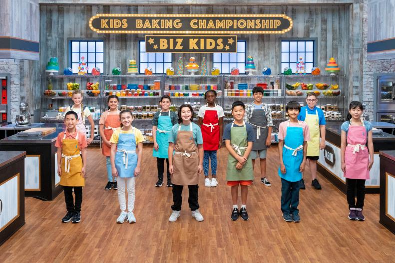 Contestants Jason, Peyton, Logan, Toby, Sohan, Naho, Foster, Genevieve, Ozan, Alissa, Naiel, and Nash, as seen on Kids Baking Championship, Season 11.