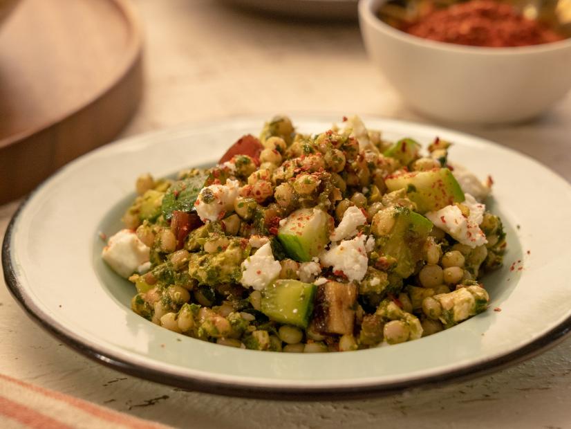 Beauty Shot of Molly Yeh's Couscous Salad with Pistachios and Dates as seen on Girl Meets Farm, Season 12.