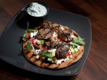 Anne Burrell’s Lamb Souvlaki Wrap with Tzatziki is displayed, as seen on Worst Cooks in America, Season 25.