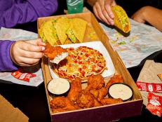 But for all the games between now and the big one, the chain is dropping the 'Ultimate GameDay Box,' which bundles pizza, tacos and its Crispy Chicken Wings (yes, they’re back!).