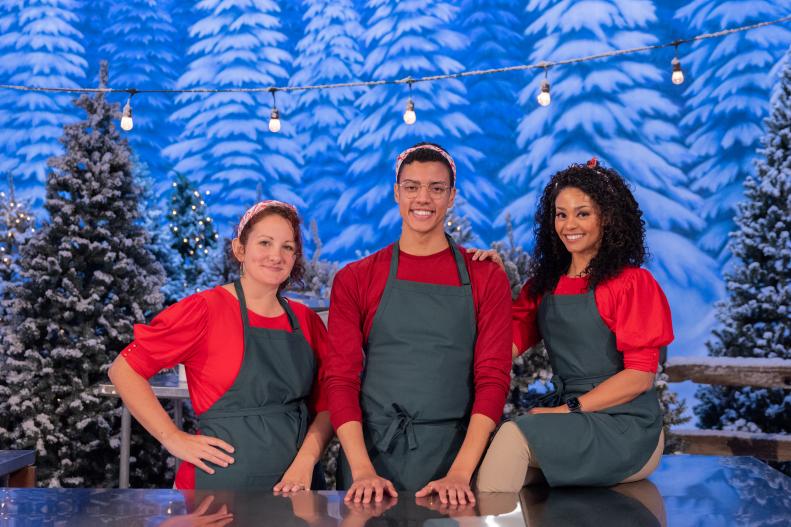 Aaron Davis, Becky Beverly and Nayara Ranieri of the Blitzen Bakers as seen on round 1, "Manufacturing Mishaps" challenge on Holiday Wars, Season 5.