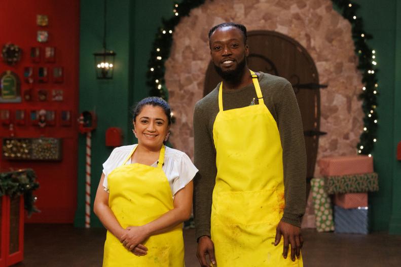 Sweet makers Cinthya Romriell and Blaque Shelton pose together, as seen on The Elf on the Shelf: Sweet Showdown, Season 1.