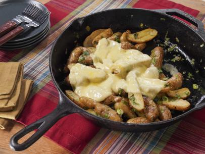 Sunny Anderson's Roasted and Herbed Fingerling Potatoes with Cheese Beauty, as seen on The Kitchen, Season 35.