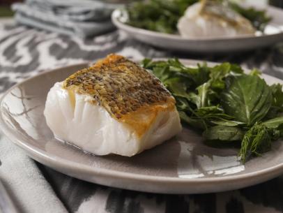 Geoffrey Zakarian's Simple Seared Fish on Parchment Paper with an Herb Salad  Beauty, as seen on The Kitchen, Season 35.