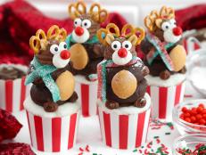 Get ready to “sleigh” your holiday dessert game with these festive reindeer cupcakes. A marbled eggnog-and-chocolate cupcake base is the delicious beginning to these treats. The whimsical reindeer topper is crafted from two stacked mini chocolate doughnuts and a wafer cookie, then adorned with rich chocolate buttercream, candies, peanuts and mini pretzel twists for adorable antlers. If you want to make assembling them a festive project for a holiday get-together, you can even prepare the cupcakes and buttercream a day or two ahead (see Cook’s Note for details).