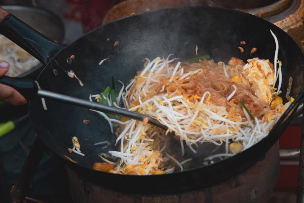 Thai street fast food in hot pan, Pad Thai thai noodle