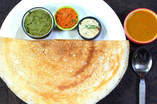 Dosa also called as Thosai is a south indian popular food made out of rice dough and eaten with chutney and sambar.