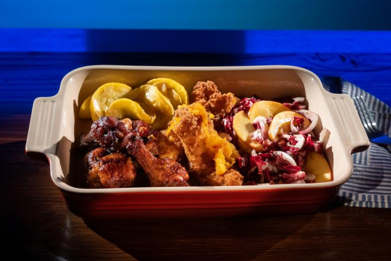 Contestant Zach Hutton's dish - Chicken Tenders, Glazed Wings, Raddicchio and Nectarine Salad, as seen on Guy's Grocery Games, Season 28.