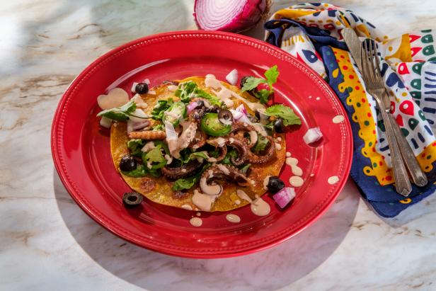 Mexican octopus tostada flat tacos with orange chipotle sauce