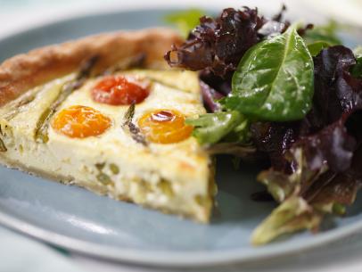 Sunny Anderson's Easy Asparagus and Tomato Quiche Beauty, as seen on The Kitchen, Season 33.