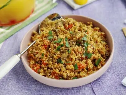 Kardea's Oyster Rice, with white onion, bell pepper, celery, and tomato.