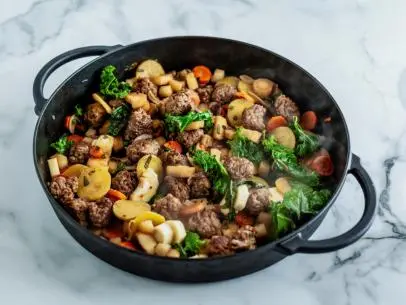 Close-up of Root Vegetables with Spicy Sausage
