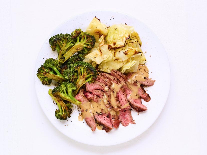 FLANK STEAK WITH ROASTED BROCCOLI AND CABBAGE.