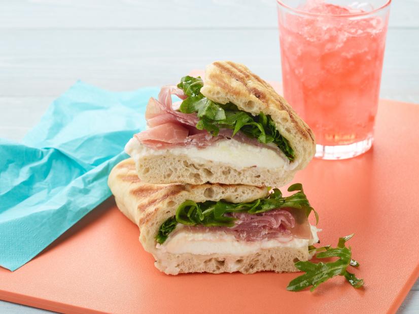 Food Network Kitchen’s Grilled Pizza Dough Arugula and Prosciutto Sandwiches as seen on Food Network.
