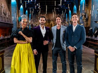 Judges Carla Hall and Jozef Youssef with Hosts James and Oliver Phelps in The Great Hall, as seen on Harry Potter: Wizards of Baking, Season 1.