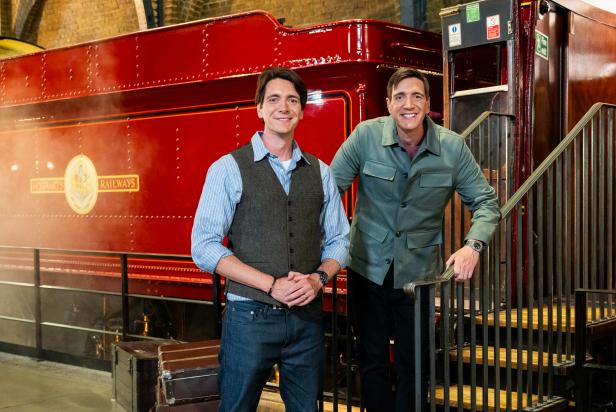 Hosts James and Oliver Phelps at Platform 9¾, as seen on Harry Potter: Wizards of Baking, Season 1.