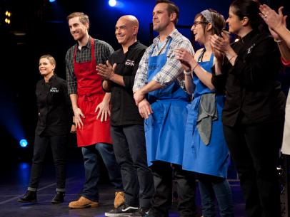 Chef Cat Cora, left, and Cook Ben Portman, second from left, react as they advance to the next round during the judging of the fifth round of competition, as seen on Food Network's America's Best Cook, Season 1.