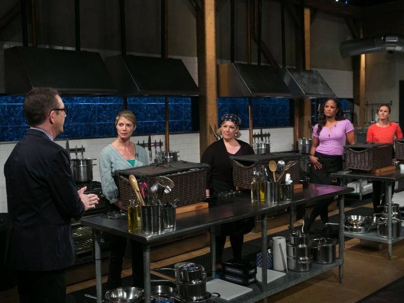Celebrity chefs (L-R): Gillian Vigman, Carnie Wilson, Laila Ali and Brandi Chastain listen to host Ted Allen explain the rules of the appetizer round as they all compete for a slot in the Chopped Ultimate Championship competition, the winner of which receives $50,000 and a new car from Buick, as seen on Food Network's Chopped, Season 21.