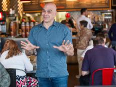 Host Michael Symon breaking down to the camera his pleasing visit to Hattie B's , as seen on Food Networkâ  s Burgers, Brew and 'Que, Season 1.