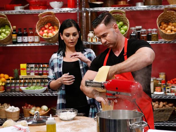 Jenni gives Mike a hand