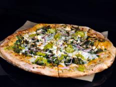 This Detroit brewery makes “the best beer in the world,” according to Michael Symon, who stopped by with Kendra Wilkinson on Burgers, Brew & ‘Que. One standout option is the gose, a sour beer that’s made with coriander, yuzu, lime and lemon peel. The duo paired their brews with a Spinach & Artichoke Pizza: a beer-dough crust smothered in a creamy bechamel studded with spinach and artichokes. The pie is finished with a flurry of lemon zest to tie all the flavors together.