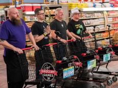 Contestants Louis Remillard, Bobby Marcotte, Adam Sappington, and Zane Caplansky wait for the NYC Frozen Food Feud to begin, as seen on Food Network's Guy's Grocery Games, Season 12.