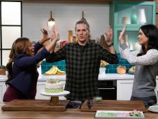 Hosts Tregaye Fraser and Spike Mendelsohn and guest Katie Lee demonstrate the Club Sandwich Cake, as seen on Food Network's The Kitchen Sink, Season 2.