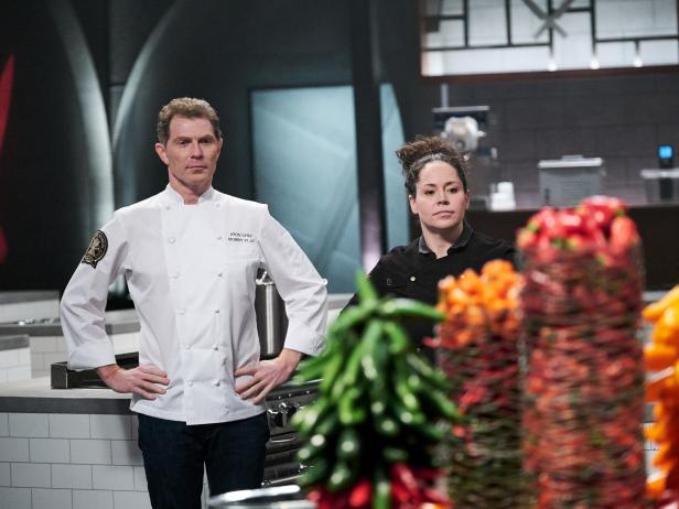 Iron Chef Bobby Flay and Chef Stephanie Izard during the reveal of the Pepper Battle, as seen on Iron Chef Gauntlet, Season 1.