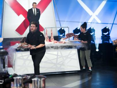 Under the watchful eye of Chairman Mark Dacascos, Iron Chef Stephanie Izard and contestant David LeFevre run to grab the secret ingredient, goat, as seen on Iron Chef Gauntlet, Season 2.