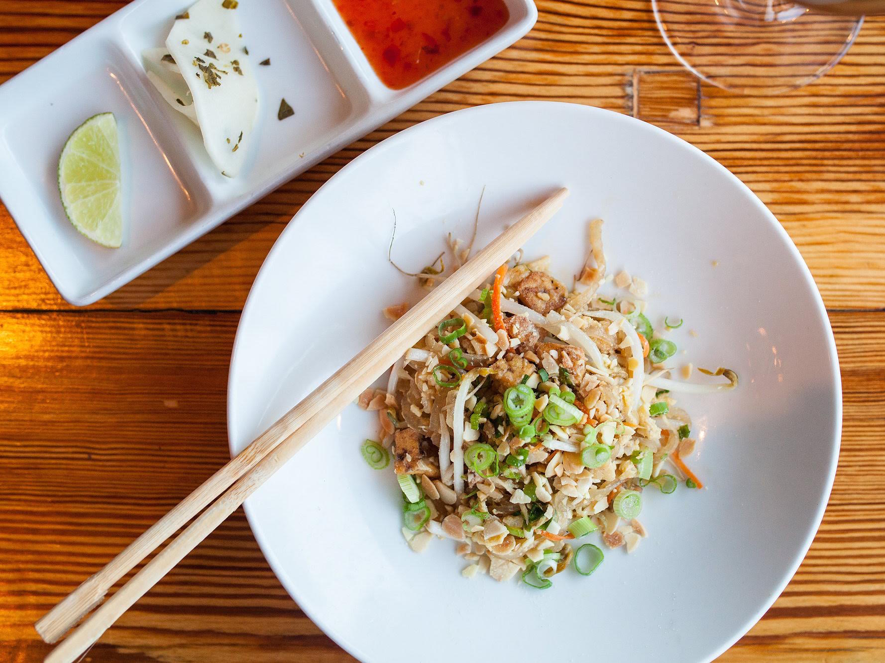 Picture pad Thai and a ganglion of stir-fried noodles coated in a sweet and savory peanut sauce typically comes to mind. But a few restaurants are upending the dish by removing noodles — at least in their typical form — and introducing heavy doses of creativity instead